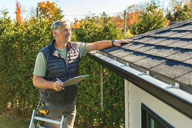 Professional Storm Damage Roof Repair technician working in Willimantic, CT